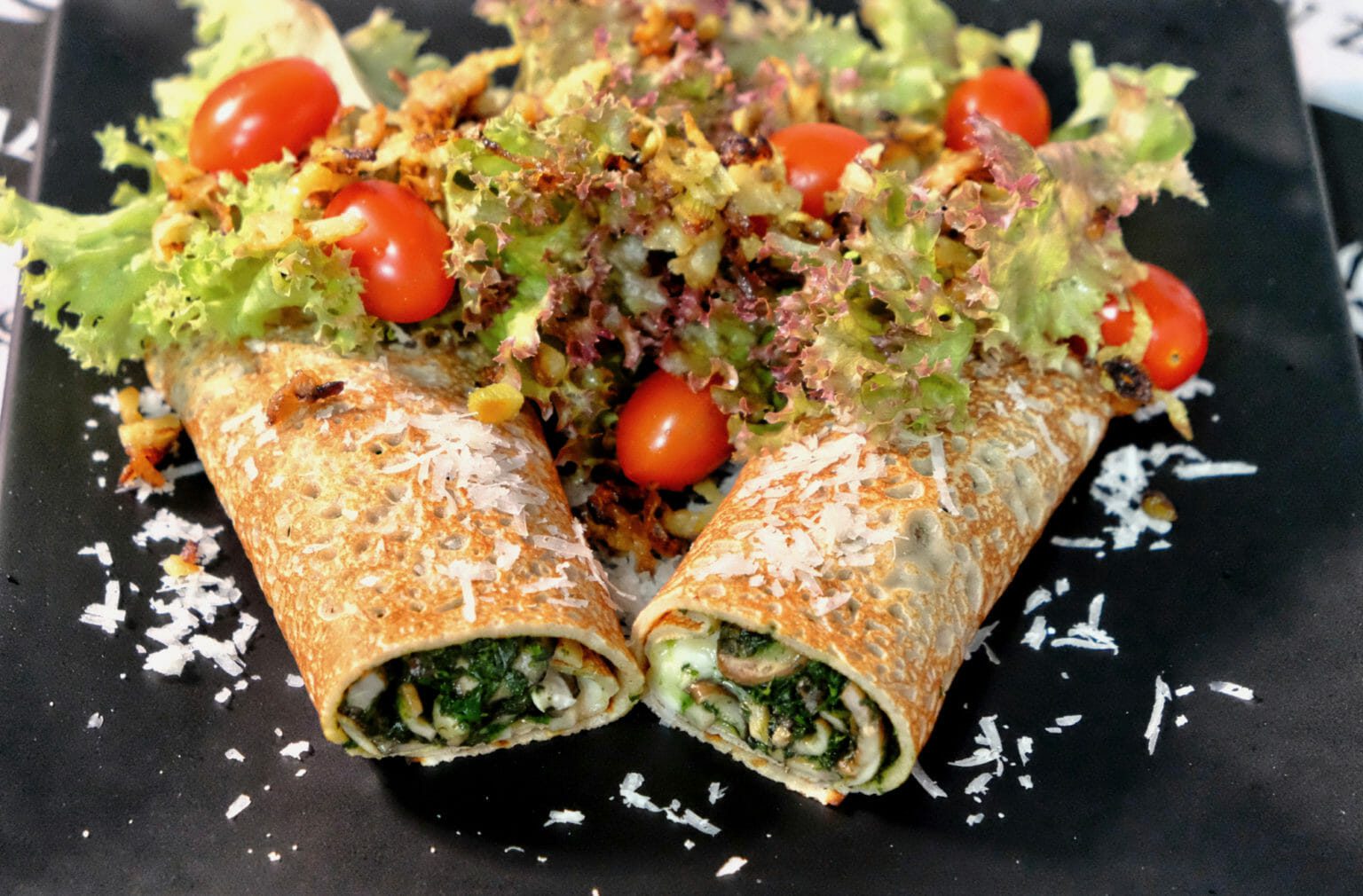 Savory buckwheat crepes filled with mushrooms and spinach delectabilia