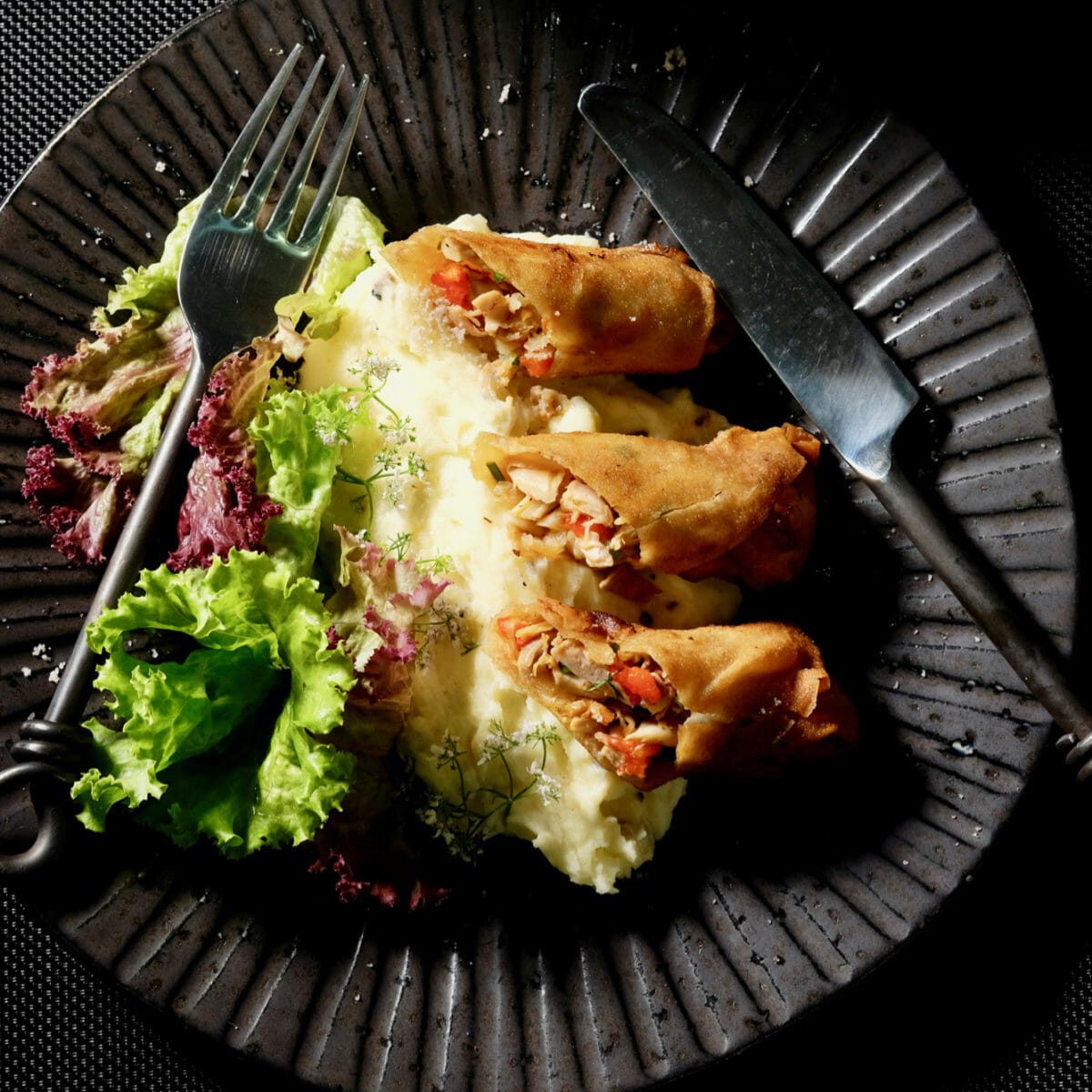 Fried chicken spring rolls XO. Truffle infused mash delectabilia