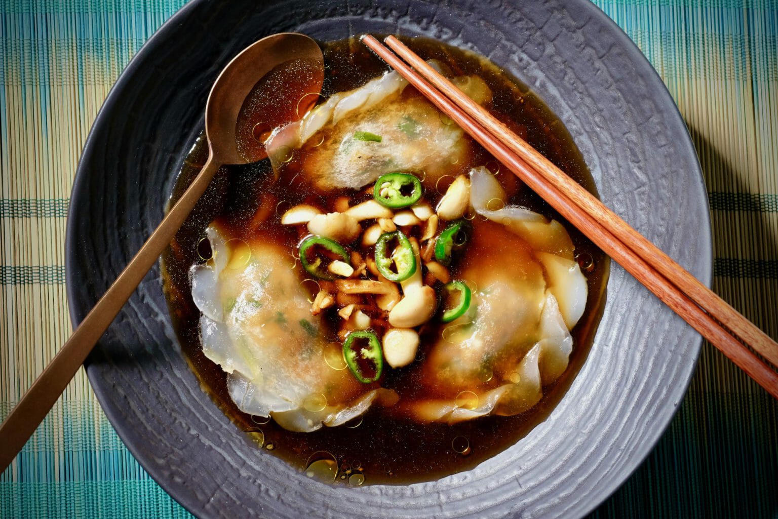 Duck dumplings in a mushroom and smoky bacon consommé delectabilia