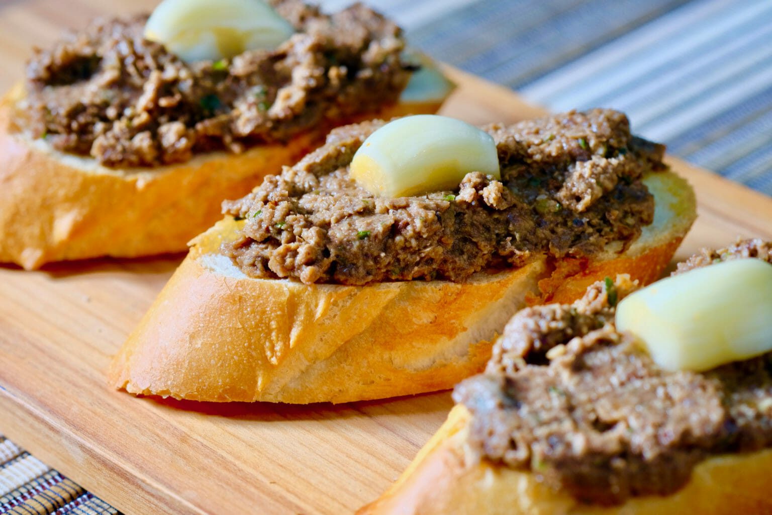 Faux gras and pickled garlic on baguette delectabilia