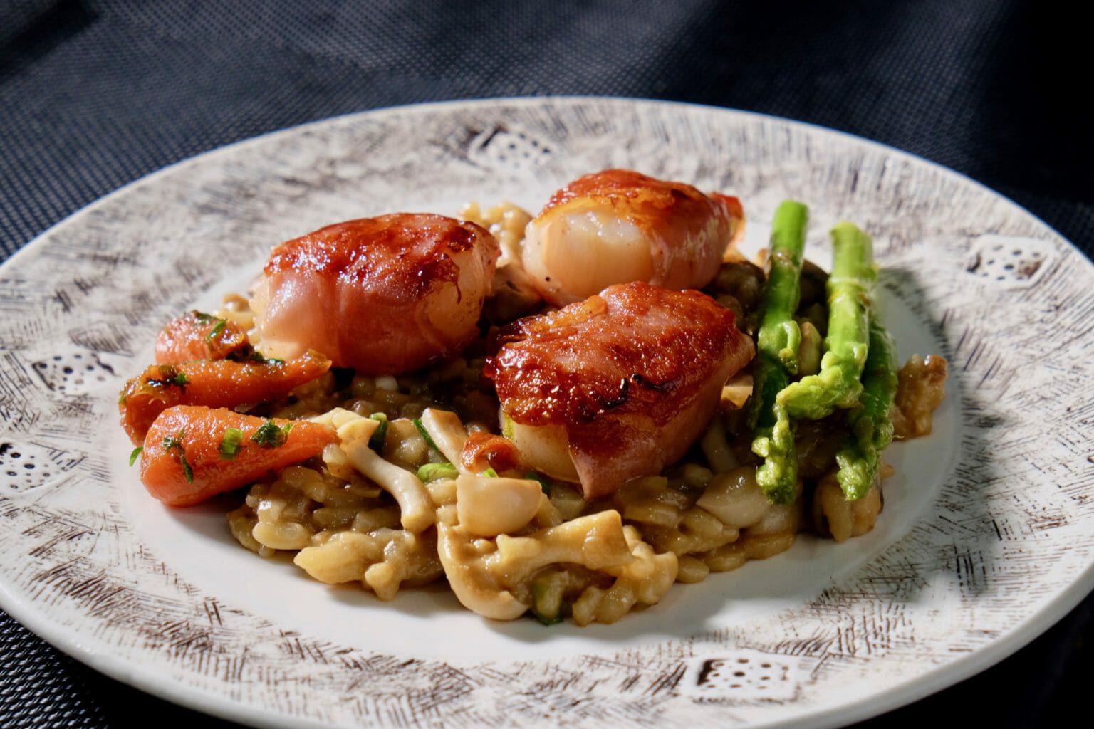 Mushroom risotto with scallops wrapped in pancetta delectabilia