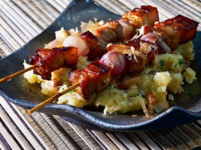 pork-belly-skewers-on-mashed-potato-salad