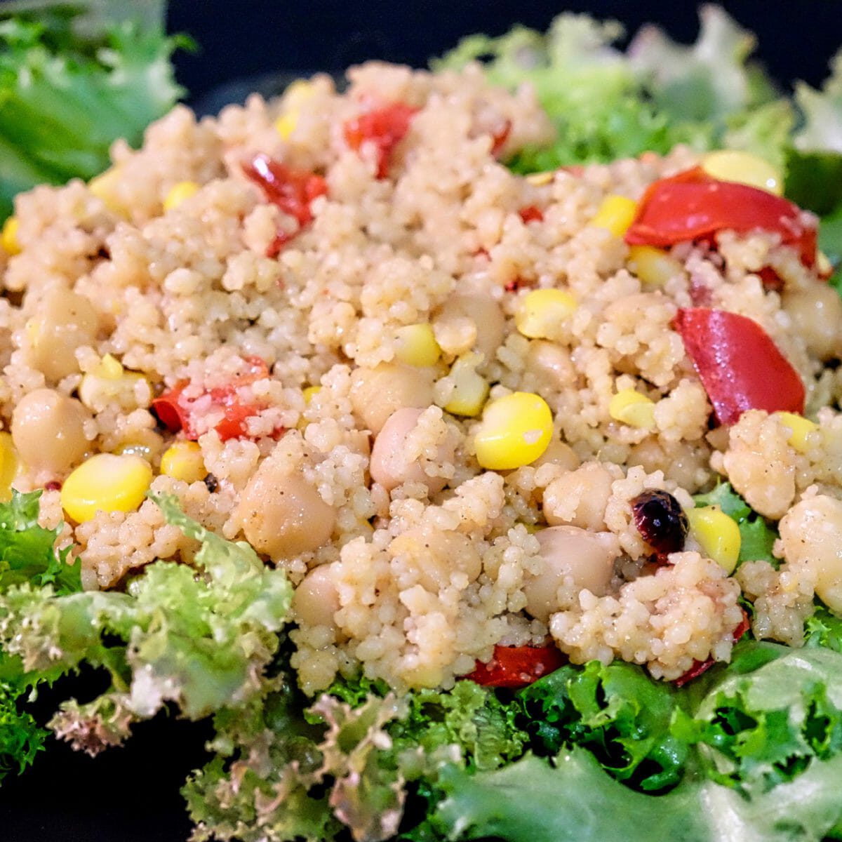 Raselhanout couscous with chickpeas, corn, red peppers delectabilia