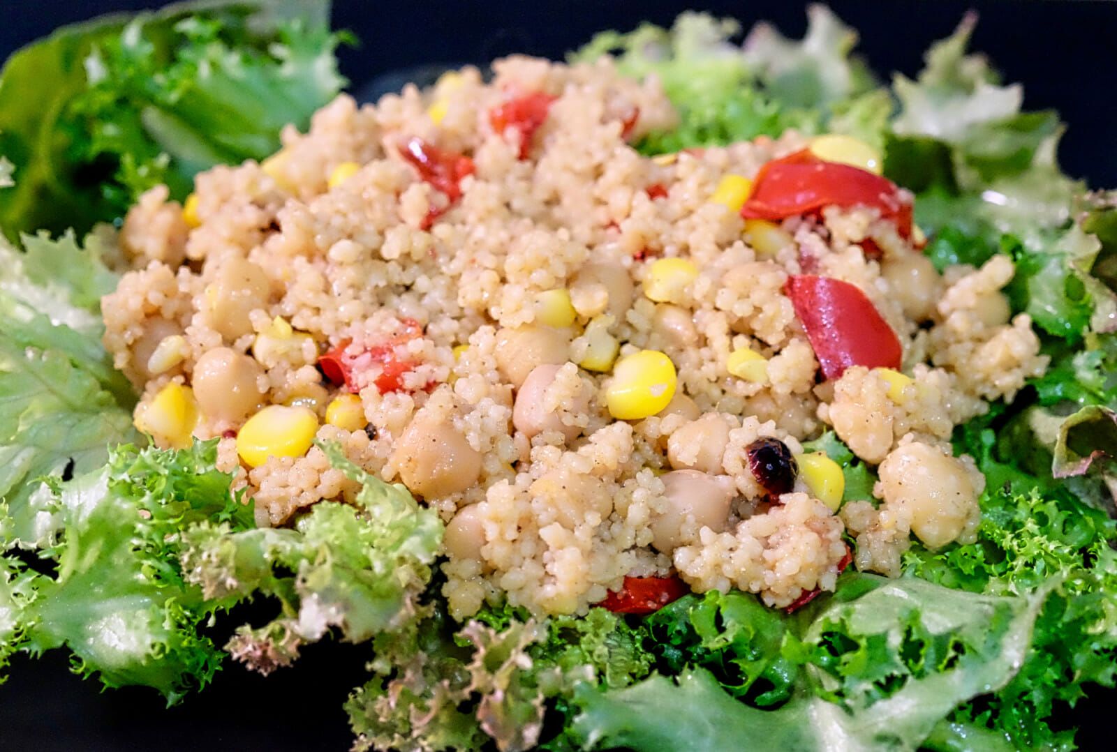 Raselhanout couscous with chickpeas, corn, red peppers delectabilia