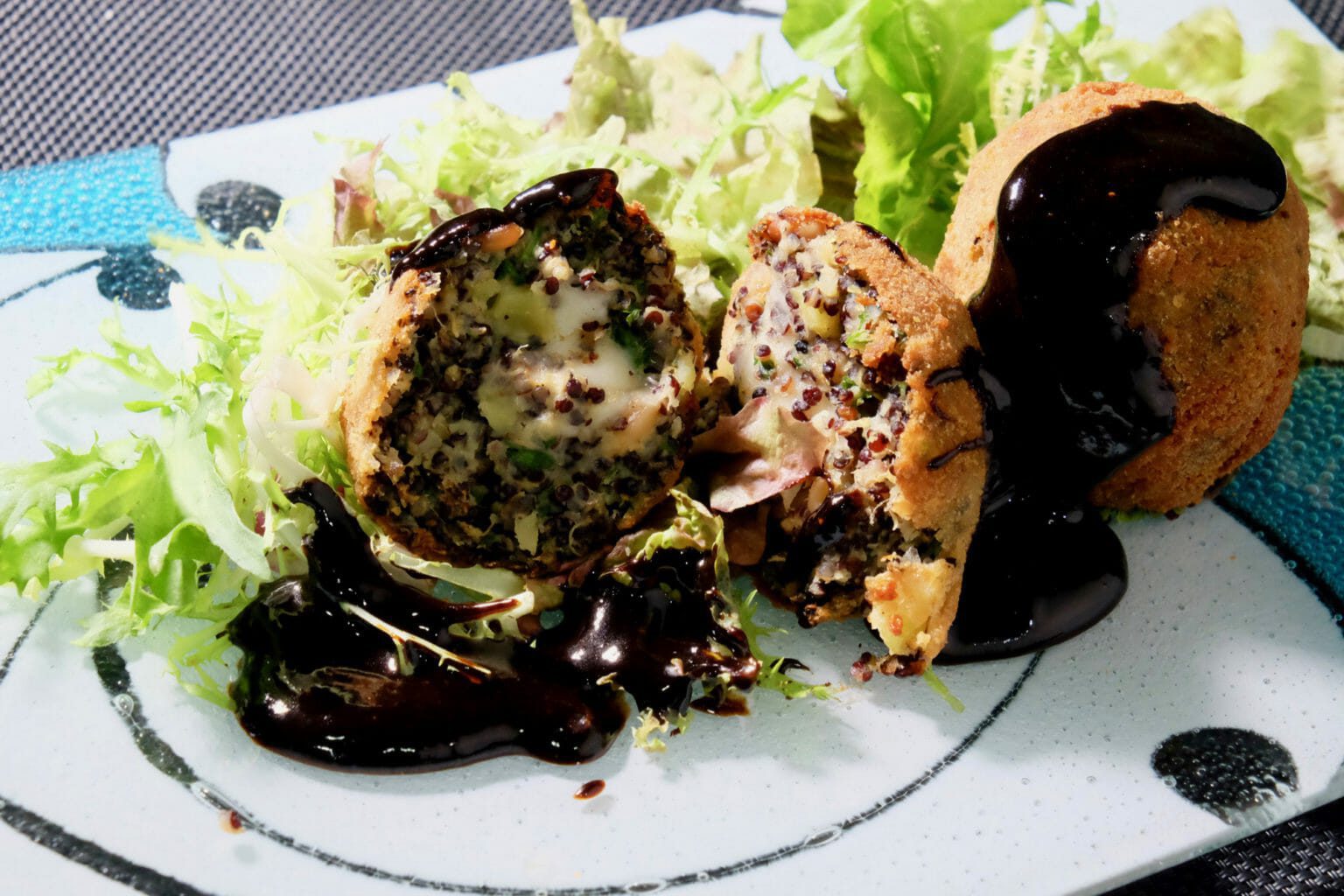 Sweet potato quinoa arancini balls. Balsamic black garlic sauce